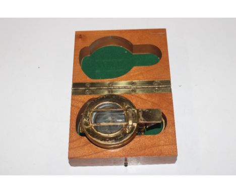 A brass military marked and dated 1940 compass in presentation box 