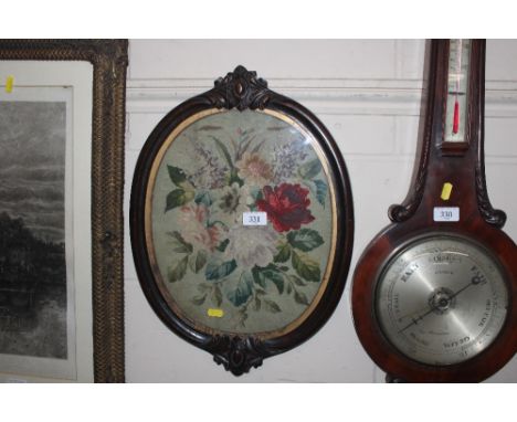 A Victorian mahogany framed needlepoint panel