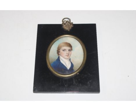 An oval portrait miniature contained in ebonised frame