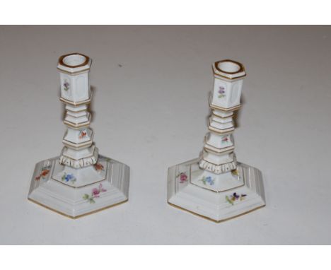A pair of Meissen porcelain candlestick decorated with flowers 