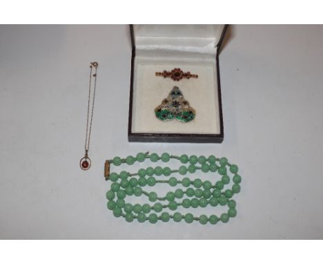 A hardstone bead necklace; a ladybird pendant on chain; and an enamel decorated pendant and brooch 