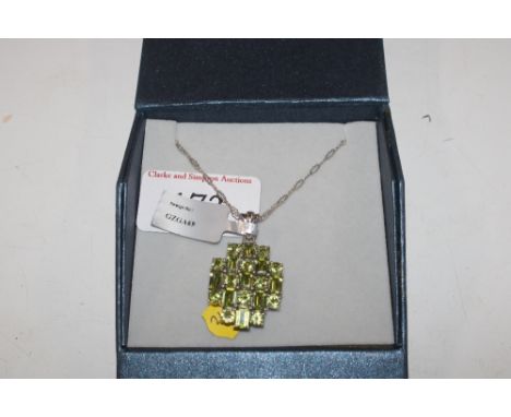 A Sterling silver peridot set pendant and chain