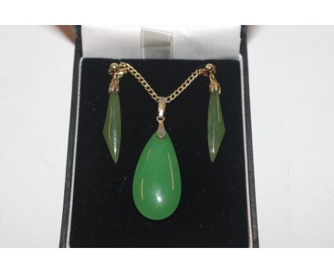 A jade pendant and pair of 9ct gold mounted ear-rings