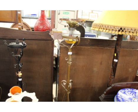 A late Victorian brass adjustable standard lamp