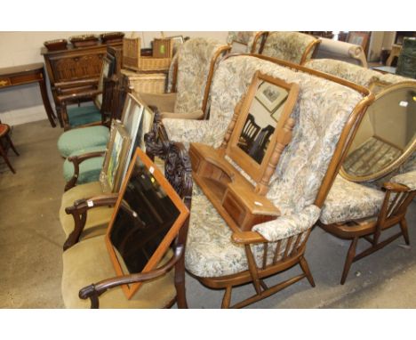 An Ercol three piece suite comprising of a two seater settee and two matching armchairs