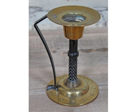A German Arts & Crafts brass and wrought metal chamber stick by Coberg, height 20cm.Condition: Minor wear, surface scratches,