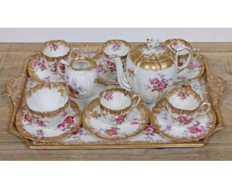 An Aynsley tea set decorated in floral sprays and gilding comprising 5 cups, 6 saucers, milk, sugar, teapot and tray.Conditio