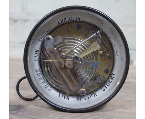 An aneroid barometer, diam. 14cm. 