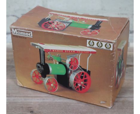 A Mamod live steam tractor, boxed and appears unused. 