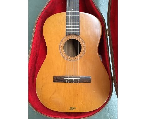 A Hofner classical guitar with tapering headstock, the flamed maple back with slight bowl, scale length 62cm, in hard case