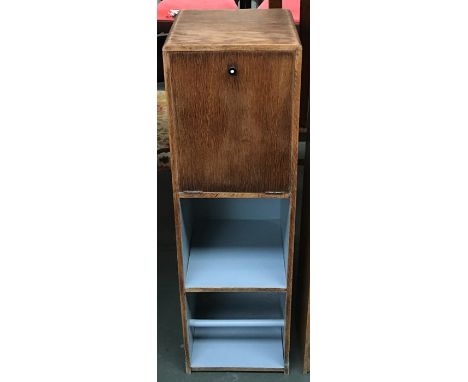 A small pine dressing unit, with hinges cupboard door over shelf and shoerack, 25x85cmH