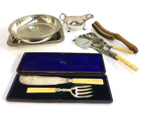 A lot of EPNS items to include sauce boat, cased fish knife and fork, crumb brush and tray and one other, and several trays