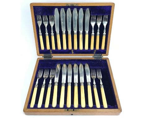 A canteen of plated fish knives and forks with bone handles, twelve place setting, one fork missing