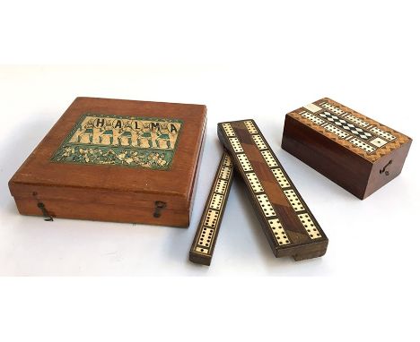 Two late 19th century rosewood and parquetry inlaid cribbage boxes, one with pegs, together with an early 20th century Halma 