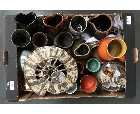A box of studio pottery including Leach St. Ives jug, Fosters, Tremar and other Cornish pottery, and an ammonite wall plaque