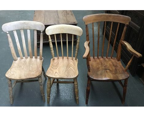 An early 20th century beech and elm kitchen stick back chair, the arms on turned supports