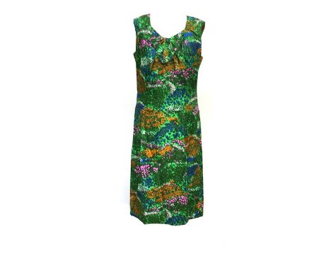 1960s sleeveless dress made by Olivia Duff of Exeter with bow detail at neck, in a predominantly green silk print of impressi