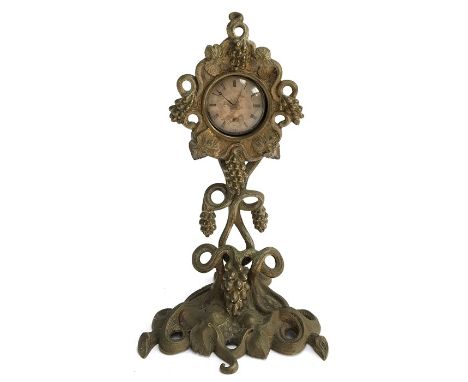 An early 20th century Art Deco pocket watch stand in the form of a fruiting vine, together with an engine turned open faced p