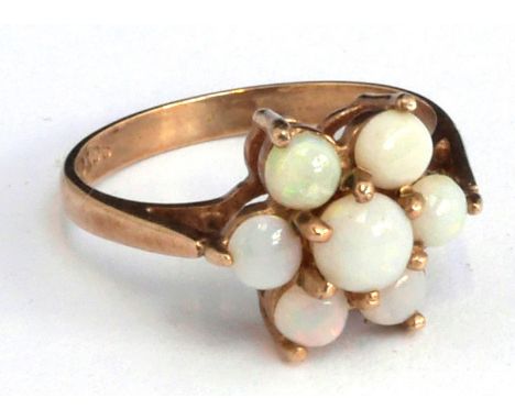 9ct gold dress ring set with 7 opals, size K, gross weight 2.2g