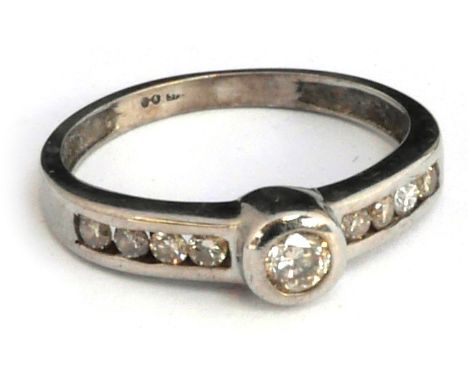 9ct white gold ring set with central brilliant cut dimaond and 4 small diamonds on each shoulder, size G, gross weight 1.4g