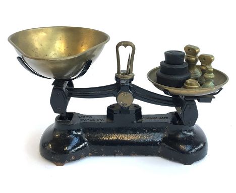 A set of Libra Scale Co. kitchen scales, with weights