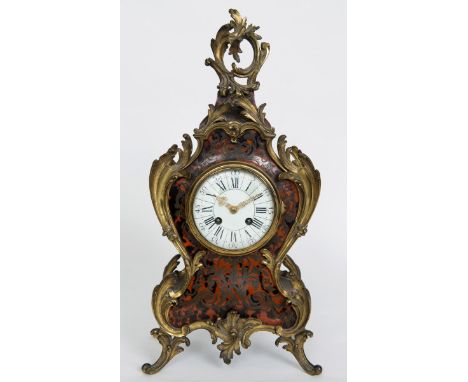 A LOUIS XV STYLE BOULLE MANTEL CLOCK 4" enamel dial on a brass movement stamped Ettienne Maxant striking to a gong in a scrol