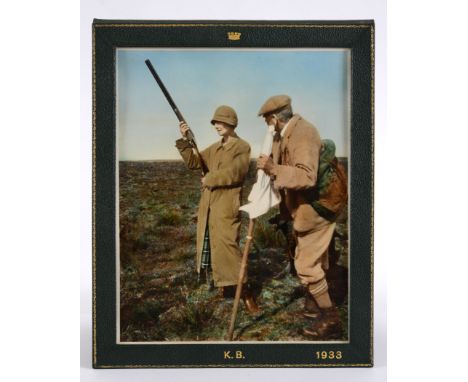 A COLOUR PHOTOGRAPH PORTRAIT OF LADY KATHLEEN BELHAVEN out on Dudwick Moor with Noble, Head Keeper, at Udny, 1933, in leather