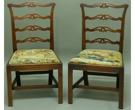 A SET OF SIX GEORGE III MAHOGANY DINING CHAIRS, late 18th century, pierced ladder back above tapestry upholstered drop in sea