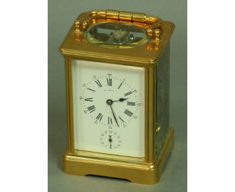 A FRENCH GILT BRASS FOUR PANE CARRIAGE CLOCK, late 19th century, the white enamel dial inscribed Hry Marc, Paris, with subsid