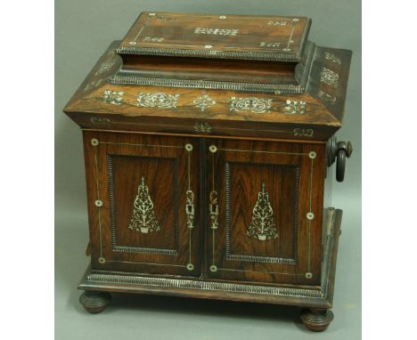 A VICTORIAN ROSEWOOD TABLE CABINET, the caddy top and panelled doors enclosing a fitted, silk lined interior with mirror abov