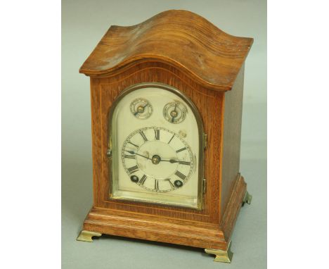 A WINTERHALDER AND HOFMEIER MANTLE CLOCK, with arching silvered dial with subsidiary fast slow and chime silent dials, on a b