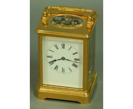 A FRENCH GILT BRASS FOUR PANE CARRIAGE CLOCK, late 19th century, white enamel dial, eight day movement stamped HJ, Paris and 
