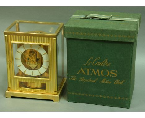 A JAEGER-LE-COULTRE ATMOS CLOCK, 1950's, movement number 60837, with white dial, textured gilt front panel, 22.5cm; together 