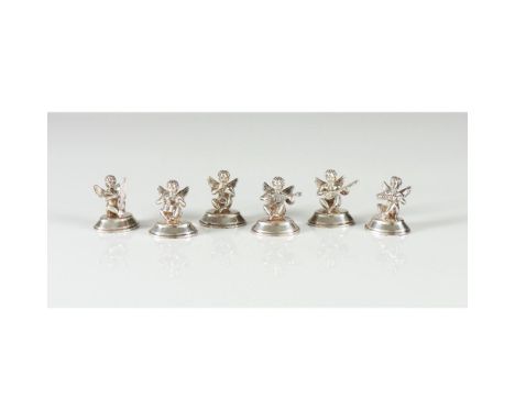 A set of 6 place markersItalian silverInstrument playing putti on pedestals: trumpet, accordion, mandolin, guitar, drums and 