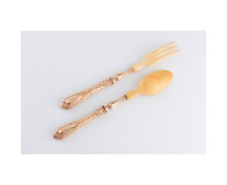 A neo renaissance salad serving setFrench silverMaker Henri SOUFFLOT, comprising of spoon and fork of gilt silver handles wit