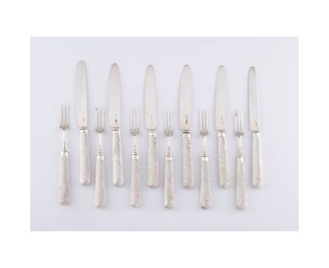 A set of dessert cutlery for 6English silverComprising of 6 knives and 6 forks, with silver handles, blades and forks. Spiral