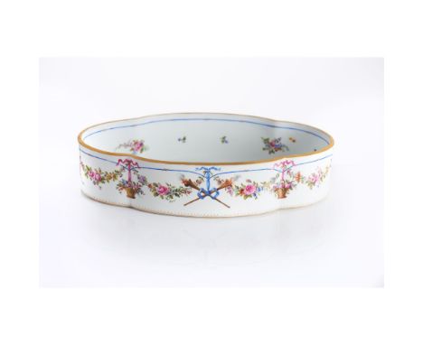 A Louis XVIII jardiniereFrancePorcelain of manual neoclassical decoration with flaming  and fuming torches crossed and tied b