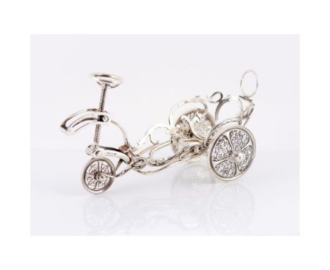 A bottle holder chariotFrench silverMaker BOULENGER à Paris, chariot shaped, the frame of scrolls and foliage decoration, wit