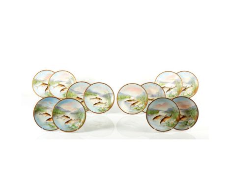 A set of 12 fish platesFranceLimoges porcelain of manual fish decoration on a ground with lake and mountainous landscapeSix d