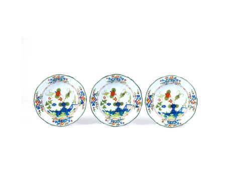 A set of 3 deep platesItalyMaker LARUCCI for Christian DIOR, Garofano model, of scalloped shape, ribbed rim and hand painted 