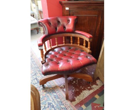 Red leather button back swivel chair