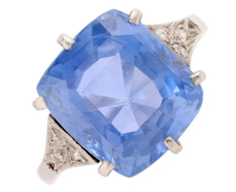A Sri Lankan No Heat Sapphire and Diamond Ring, circa 1910, claw set with a cushion cut sapphire of approximately 9.07 carats