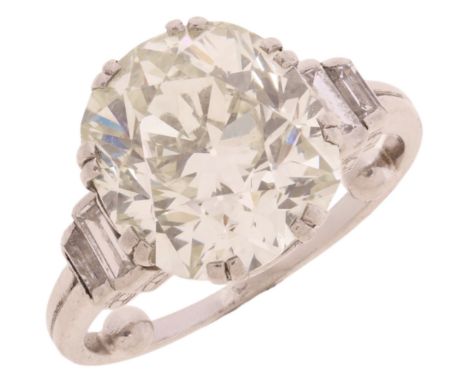 An Art Deco 7.14ct Single Stone Diamond Ring, circa 1920, split claw set with 7.14 carat old transitional-cut diamond, flanke