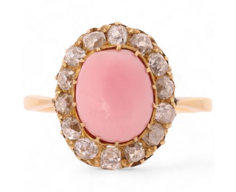 A Non-Nacreous Conch Pearl and Diamond Ring, the central 9.14mm egg-shaped whole conch pearl in claw setting, surrounded by o