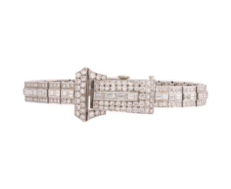An Art Deco Lady's Platinum and Diamond Bracelet Watch, circa 1930, the rectangular silvered dial with black Arabic numerals 