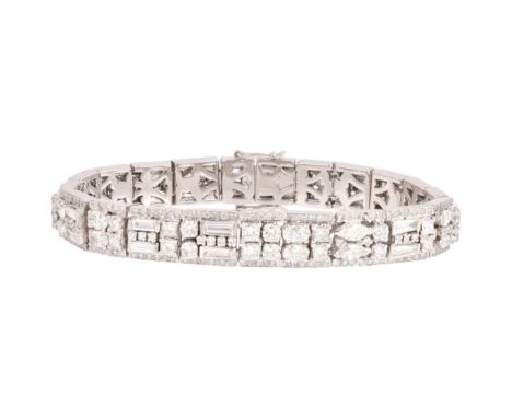 A Diamond Bracelet, each panel centrally set with vari-cut diamonds including shield baguette marquise Princess oval pear and