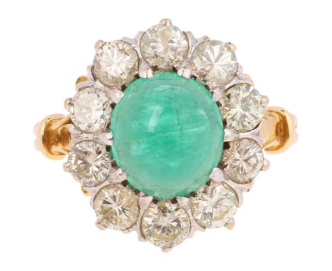 An Emerald and Diamond Cluster Ring, claw set with an oval cabochon emerald of approximately 3.00 carats, surrounded by moder
