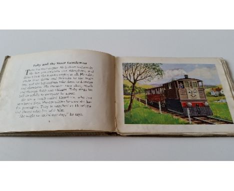 CHILDRENS BOOK, hardback edition of Toby The Tram Engine by The Rev W Awdry, with grey boards and red titles (stained), sligh