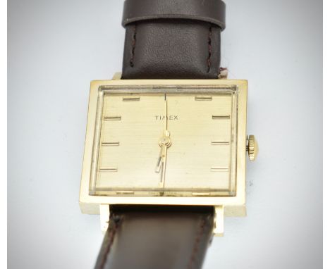 A mid century retro square faced Timex retro gentleman's wristwatch.Gold plated square case with champagne dial, horizontal b