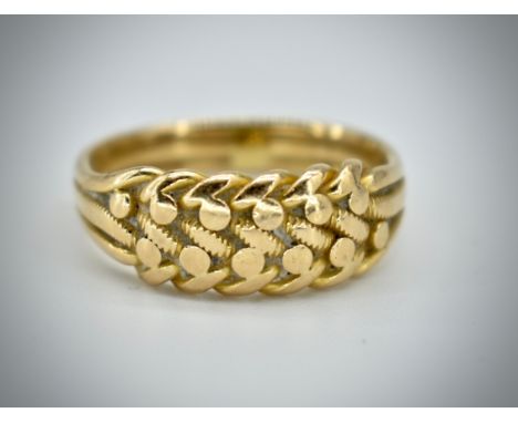 A Victorian 18ct gold hallmarked keeper ring. The believed Chester ( partially rubbed ) hallmarked ring with woven front havi